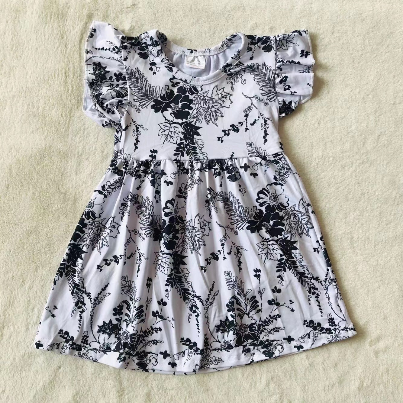 Baby girls black floral pearl dresses